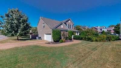 3 Sides Brick home with side entry garage. Extra long driveway with plenty of extra parking. | Image 2