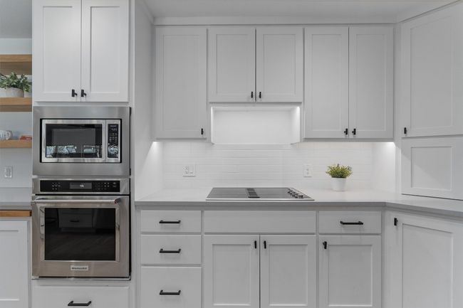 Featuring under-cabinet lighting for a soft, welcoming glow. | Image 11