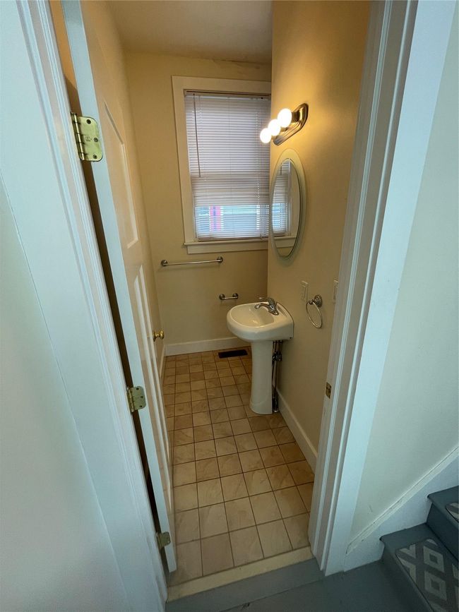 Half bathroom with tile patterned flooring and baseboards | Image 11