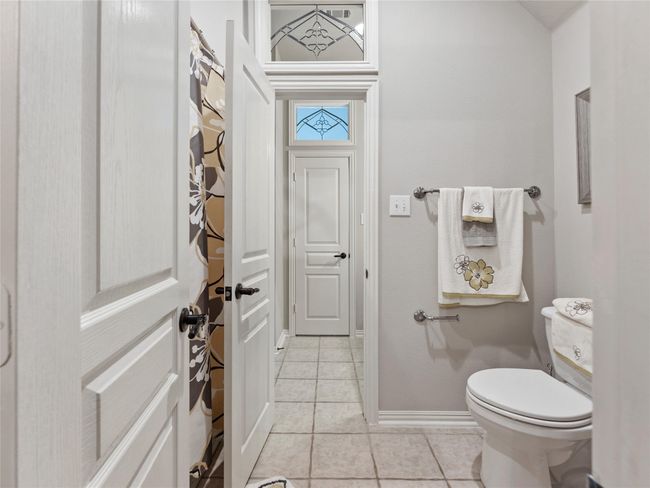 Bathroom with tile patterned floors and toilet | Image 28