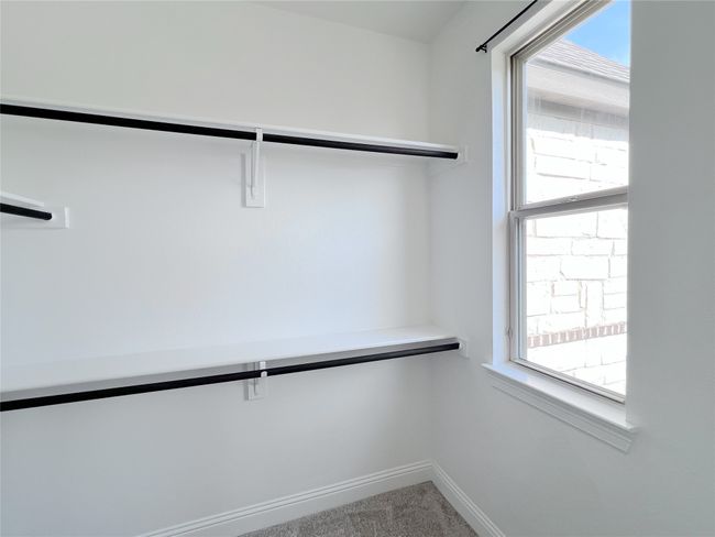 Spacious closet featuring carpet floors | Image 32