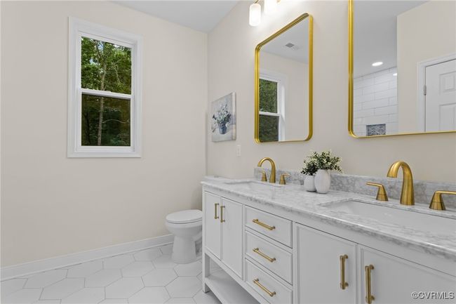 Bathroom featuring double vanity and tile patterned floors | Image 29