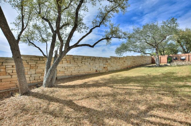 View of yard with a fenced backyard | Image 36