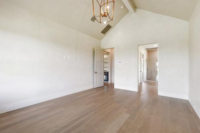Another view of the spacious primary suite underscores the proportions for luxurious furnishings and comfortable relaxation. | Image 18