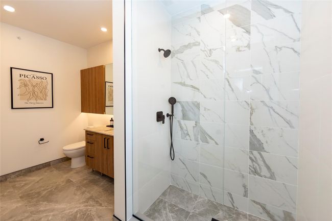 The two bedroom units will have one full bath with a tub and another with a walk-in glass enclosed shower. | Image 34