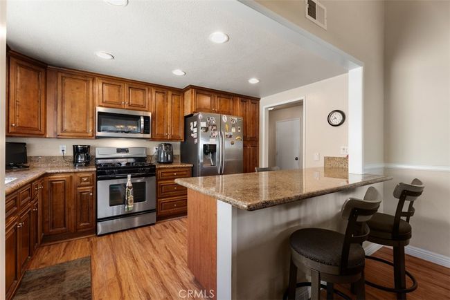 Here is a view from the dining room into the kitchen area | Image 15