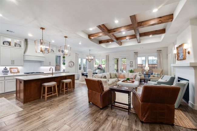 Living room featuring a chandelier, coffered ceiling, light wood-style floors, beam ceiling, and recessed lighting | Image 6