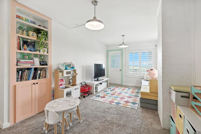 Recreation room featuring light carpet | Image 25