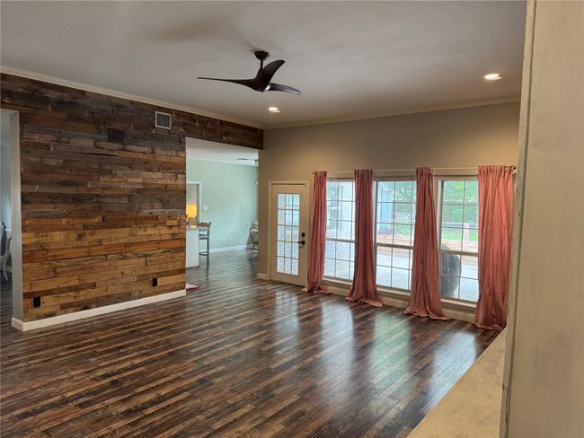 Den has an accent wood wall | Image 11