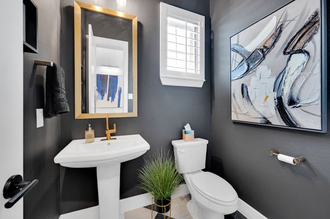 Bathroom featuring toilet and baseboards | Image 7