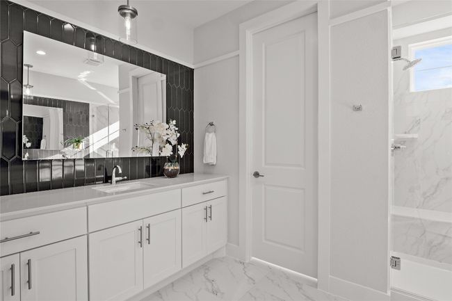 Full bath featuring baseboards, marble finish floor, vanity, and a marble finish shower | Image 21