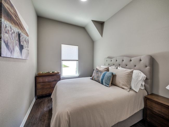 Bedroom with wood finished floors and baseboards | Image 12