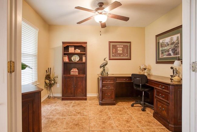 Office/study with French doors off main living area | Image 18