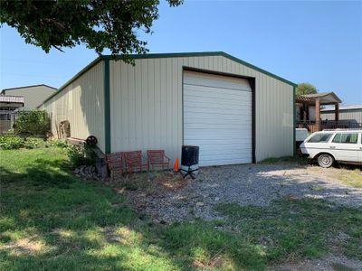 Garage with wooden walls | Image 1