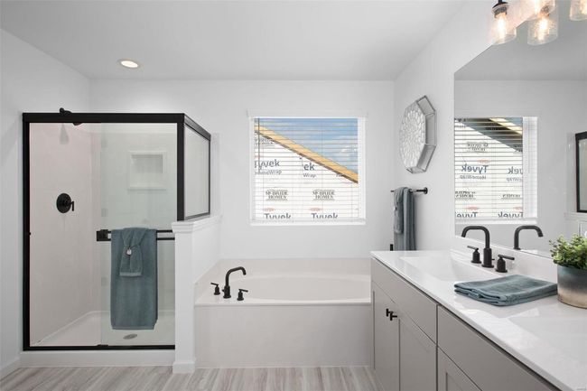 Bathroom featuring plus walk in shower, hardwood / wood-style floors, and vanity | Image 27