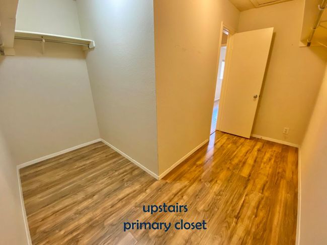 Walk-in closet with vinyl floors | Image 21