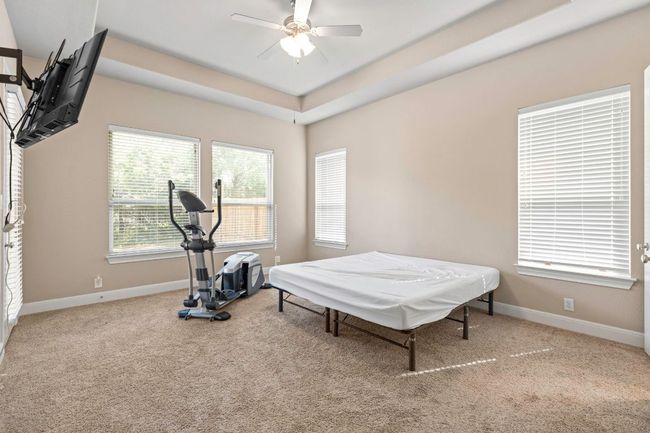Exercise room featuring carpet and ceiling fan | Image 18