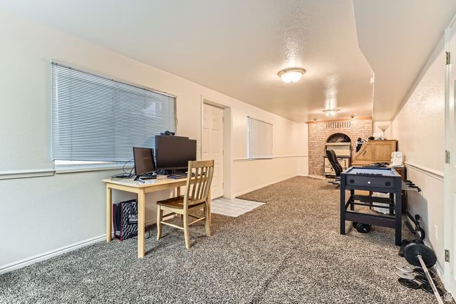 Office area with carpet floors and baseboards | Image 21