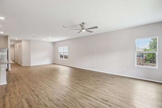 Dining and living areas flow together with ample space for a wide variety of furniture arrangements. | Image 5