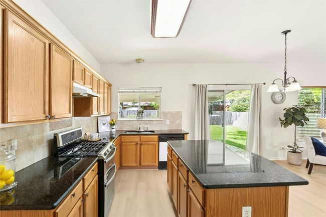 Kitchen with stainless range, microwave | Image 9