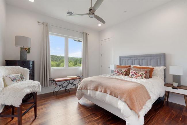 Bright and inviting, this guest room is the perfect retreat. | Image 36