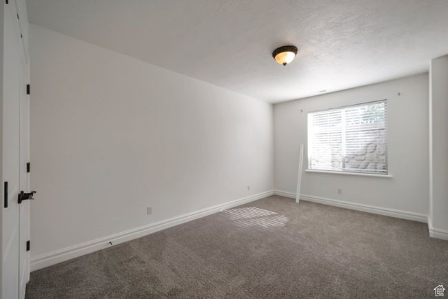Spare room with carpet and baseboards | Image 31