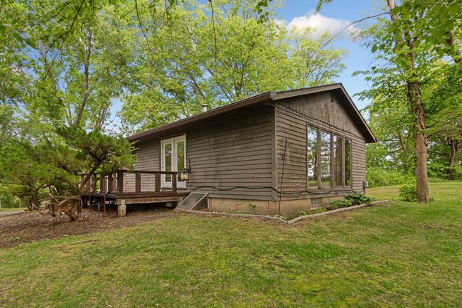 Large side deck and a larger covered deck that overlooks the lake that is just awaiting some finishing touches. | Image 5