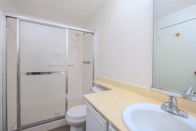 Bathroom featuring vanity and toilet | Image 25