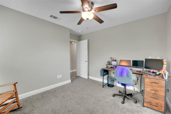 Office with ceiling fan, baseboards, carpet, and visible vents | Image 26