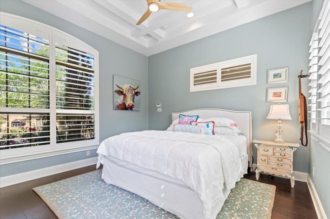Bedroom featuring a ceiling fan, wood finished floors, baseboards, beam ceiling, and recessed lighting | Image 26