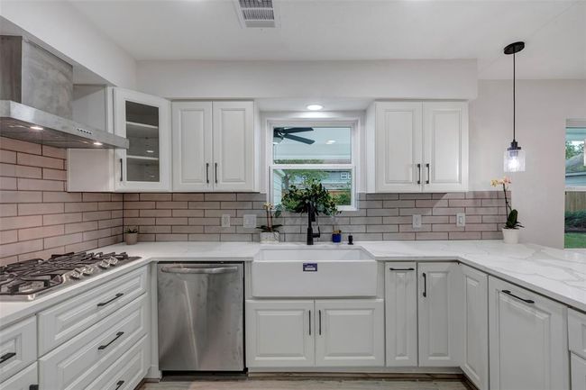 Completely newly remodeled kitchen with new appliances, Quartz countertops, light fixtures and cabinets. | Image 19