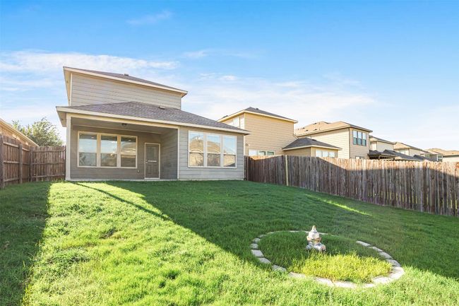 Back of house featuring a fenced backyard and a shingled roof | Image 38