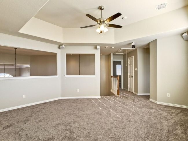 Carpeted spare room featuring attic access and a ceiling fan | Image 10