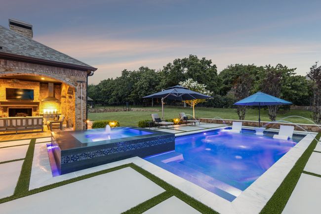 Entertain Effortlessly with LED Lighting, Relaxing Spa Fountains, Marble Coping, and a Hayward Automation System | Image 35