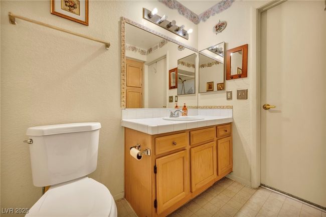Bathroom with toilet and vanity | Image 29