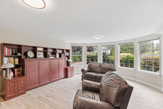 Living area with light wood-type flooring and baseboards | Image 30