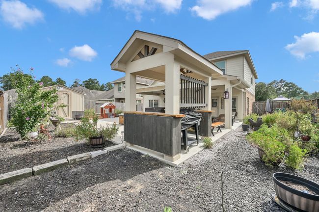 Alternate angle showcasing the backyard from the BBQ pavilion, perfect for taking in the outdoor space. | Image 35