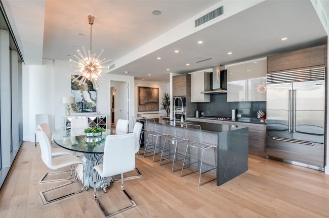 Dining space with light wood-style flooring, a chandelier, and recessed lighting | Image 7