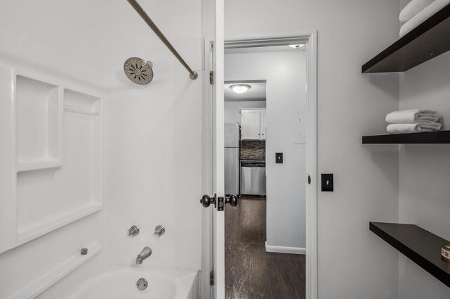 The bathroom is convenient to each bedroom and all other living spaces making it ideal for guests and everyday use. | Image 19