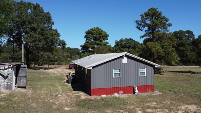 View of outdoor structure with 2023 central air condition unit. Home remodel was completed in 2023 includes 2023 septic tank and 2023 electrical upgrade. | Image 11