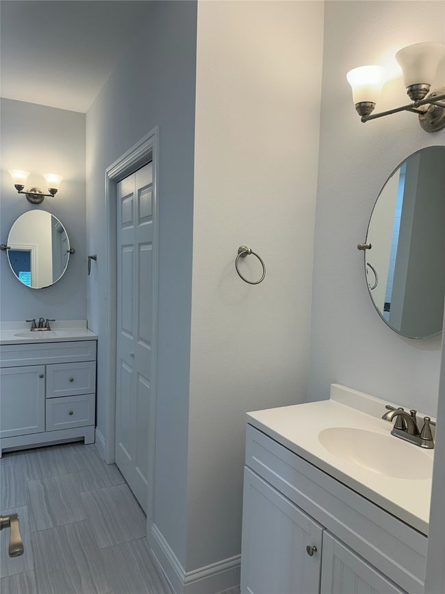 Bathroom featuring vanity and baseboards | Image 16