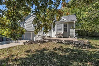 View of front of property with large front yard and a garage | Image 3