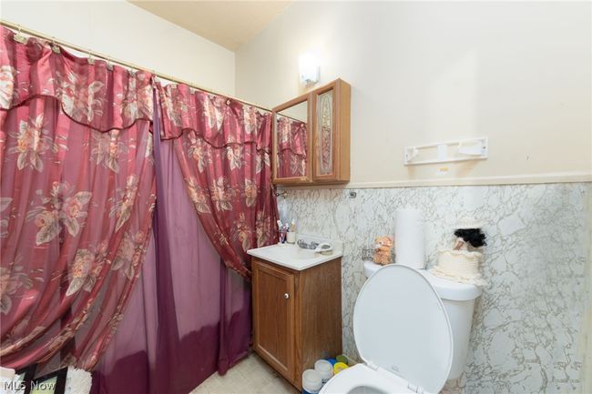 Bathroom with vanity, tile floors, and toilet | Image 24