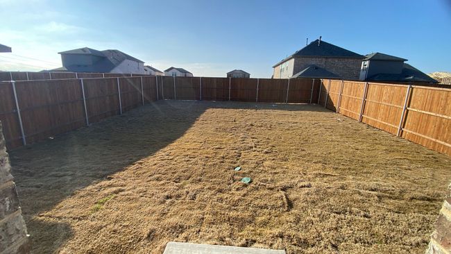 View of fenced backyard | Image 16