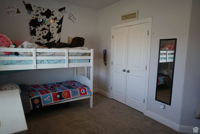 Carpeted bedroom with baseboards and a closet | Image 18