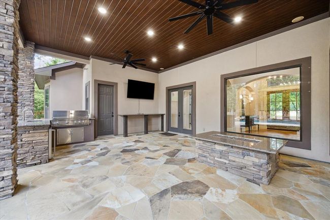 Covered Patio With Outdoor Kitchen and Fire Table | Image 41