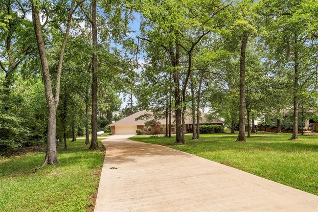Beautiful mature trees create privacy and a serene front yard setting | Image 4