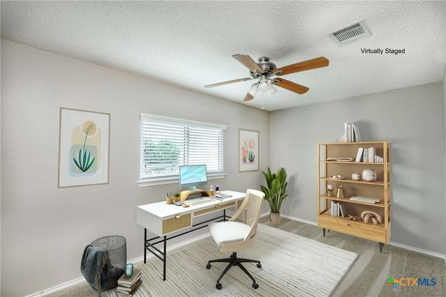 Virtually staged secondary bedroom can easily be used as an office | Image 23