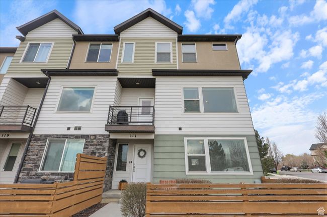 Multi unit property featuring fence, a balcony, and stone siding | Image 26