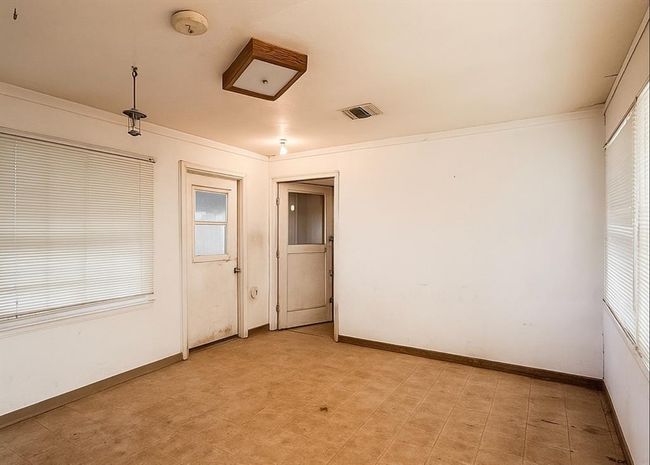 Spacious combined laundry and mudroom with ample natural light, perfect for functionality and convenience. | Image 14